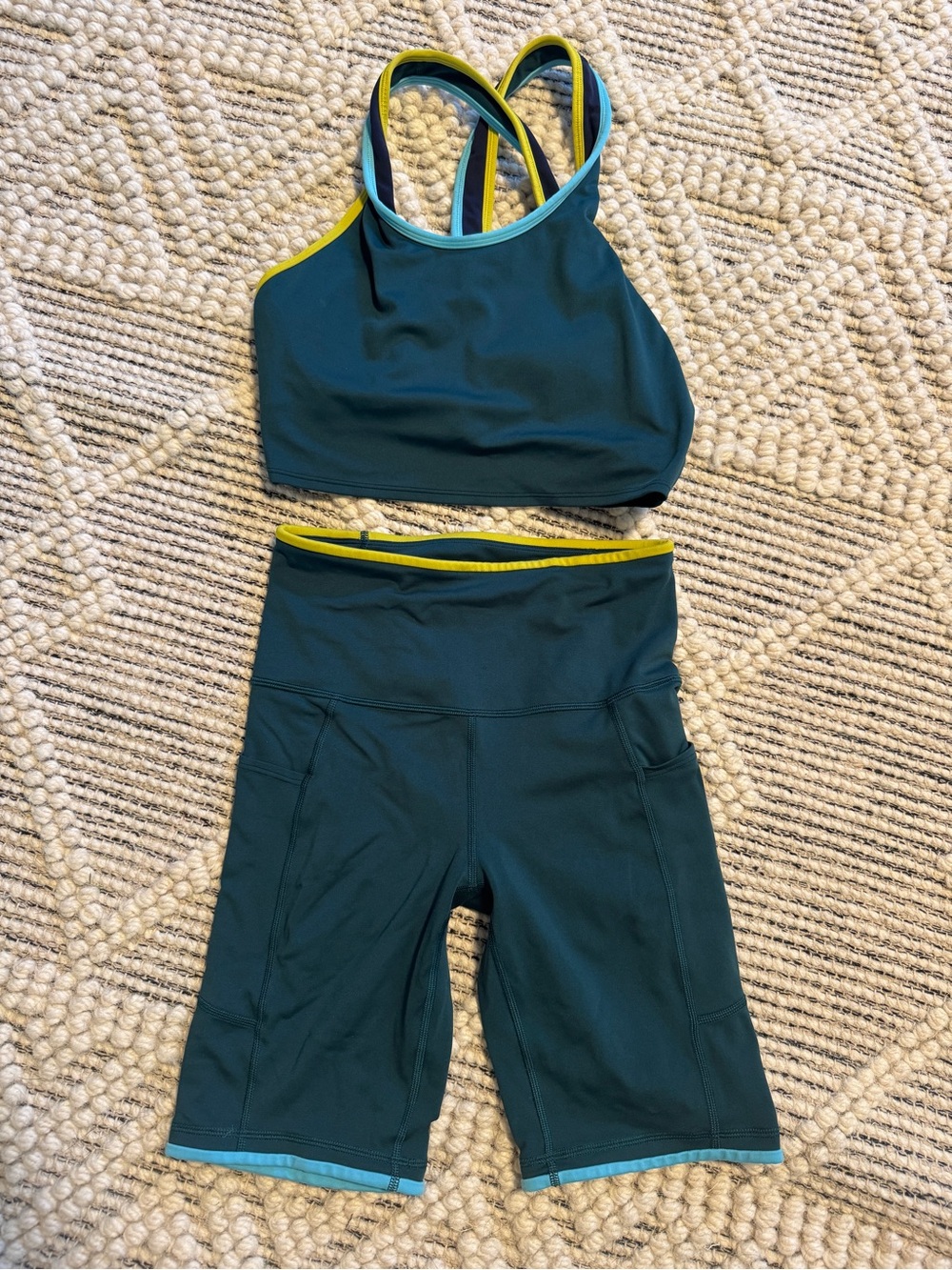 Cotopaxi Teal Athletic Crop Top and High-Waist Bike Shorts Set with Yellow Trim